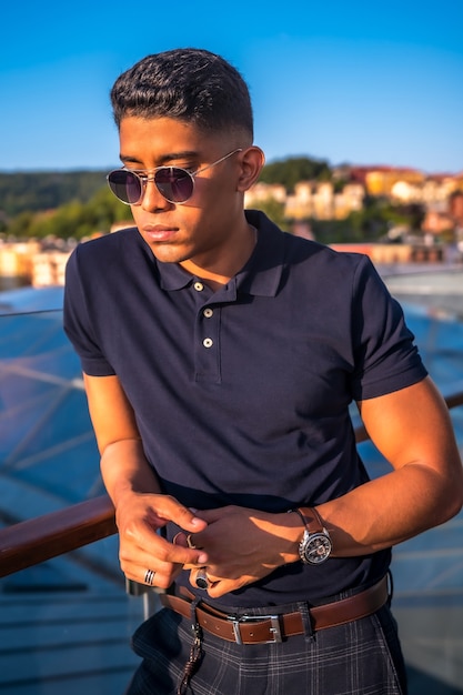 Portrait of a young Latino with the city of San Sebastian in the background, Gipuzkoa