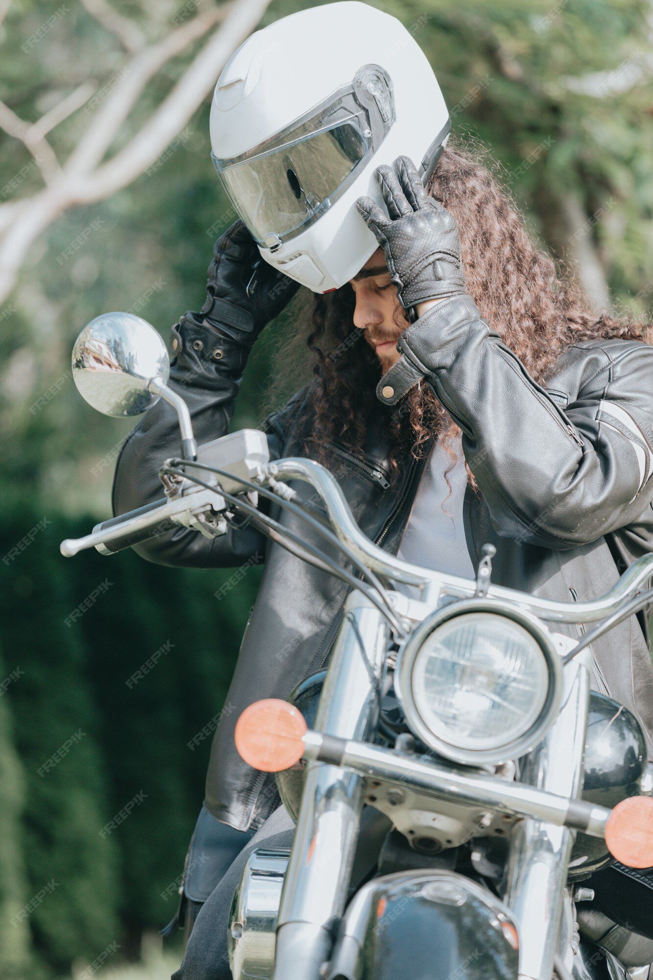 Premium Photo | Portrait of a young long hair man, an old biker in a leather jacket on a retro bike, vintage classic motorcycle. concept of freedom and style, a hobby for Premium Photo | Portrait of a young long hair man, an old biker in a leather jacket on a retro bike, vintage classic motorcycle. concept of freedom and style, a hobby for
