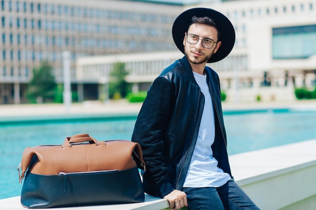 Portrait of young male in urban environment outdoors 