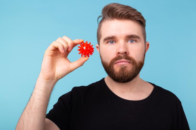 Portrait of young man against blue background