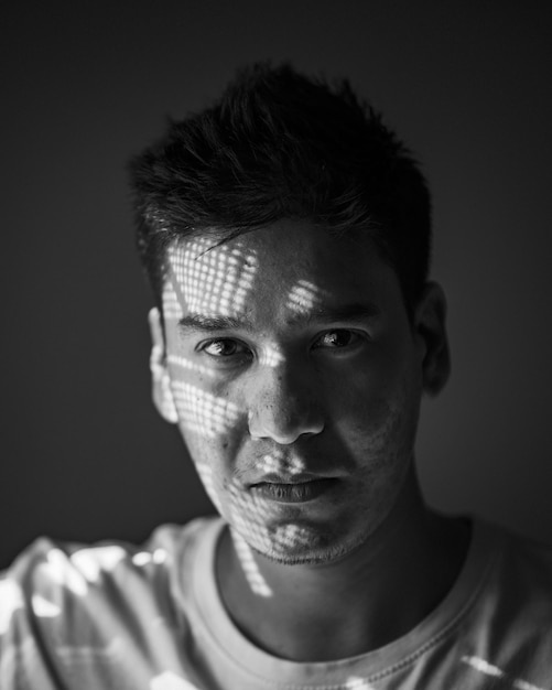 portrait of young man against wall