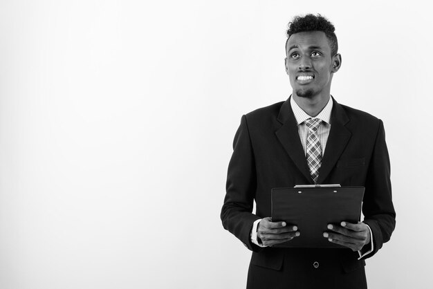 Photo portrait of young man against white background