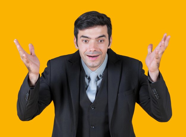 Portrait of young man against yellow background