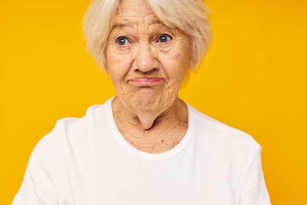 Portrait of young man against yellow background