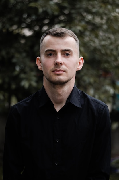 portrait of a young man in a black shirt