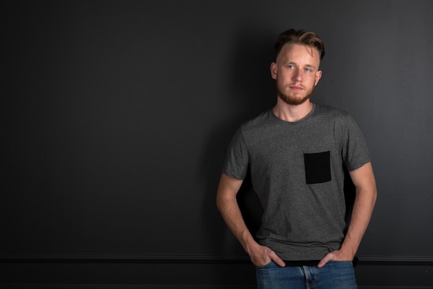 Portrait of young man above black