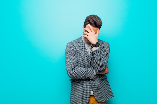 Portrait of a young man on a blue background