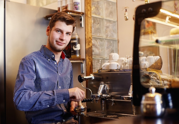 Portrait of a young man in cafeteria