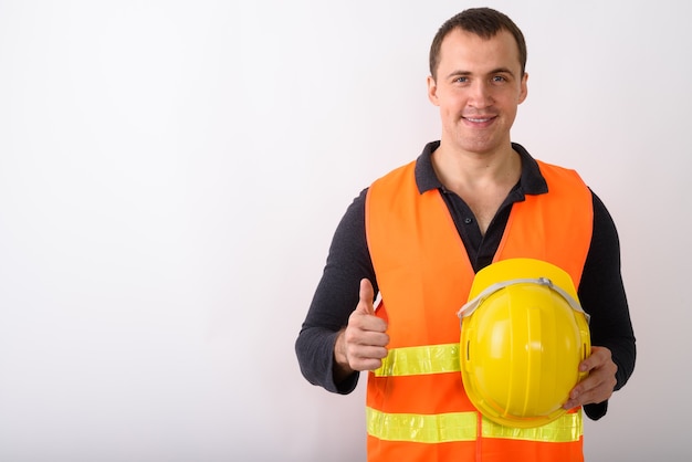 Portrait of young man construction worker standing