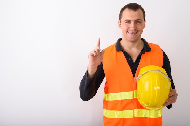 Portrait of young man construction worker standing