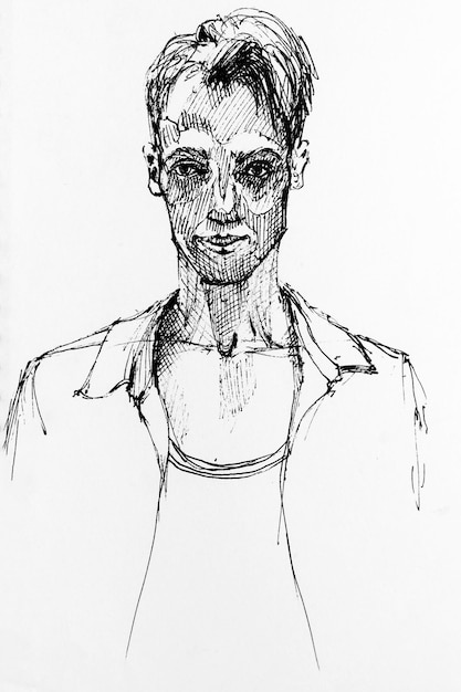 Portrait of young man drawing by hand with black ink on paper Black and white artwork