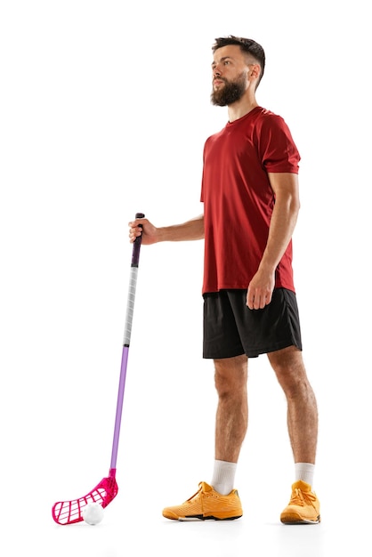 Portrait of young man floorball player with floorball stick isolated on white background sport