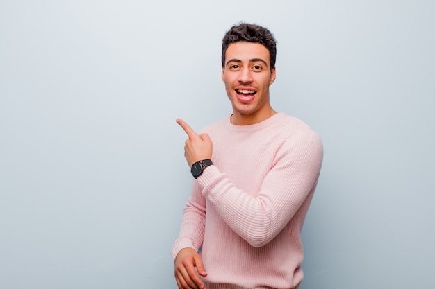 Portrait of a young man on a grey background