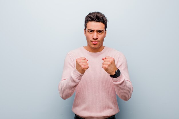 Portrait of a young man on a grey background