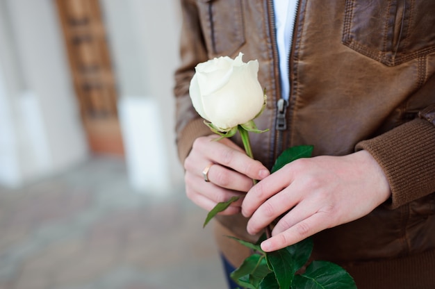 Portrait of a young man in love who is waiting for his girlfrien.