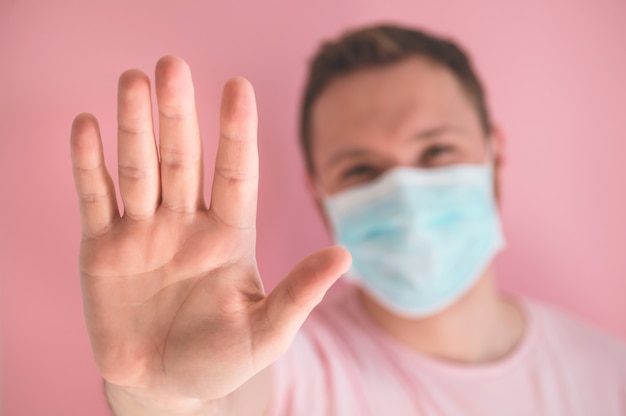 Portrait of a young man in a medical mask