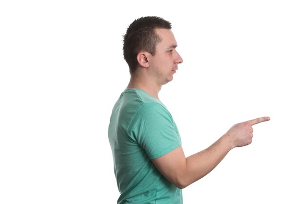 Portrait Of Young Man Pointing A Finger At You  Isolated On White Background