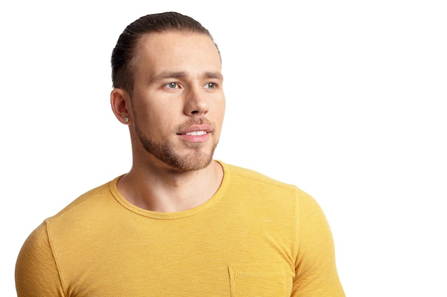 Portrait of young man posing on white background