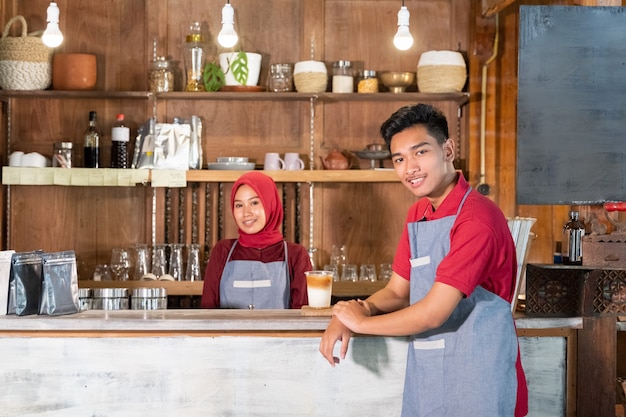 Portrait of young man preparing a drink