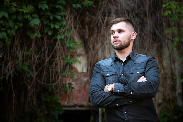 Portrait of a Young man in a shirt and trousers