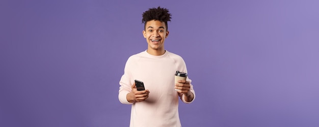 Portrait of young man standing against clear sky