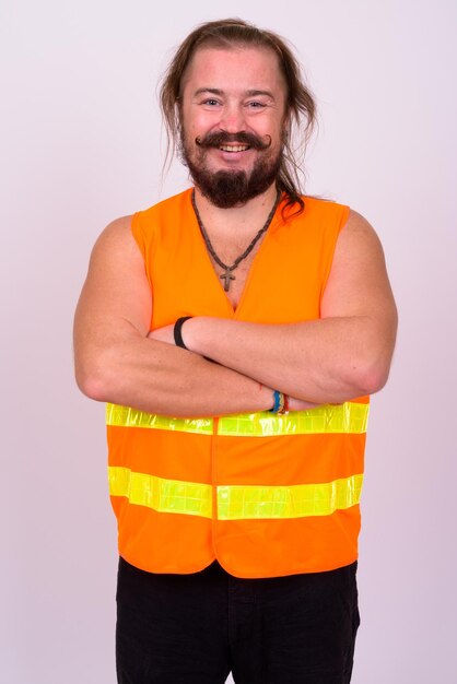 Portrait of young man standing against white background