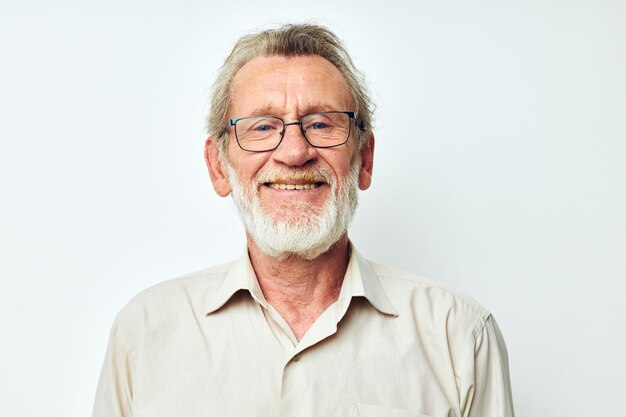 Portrait of young man standing against white background