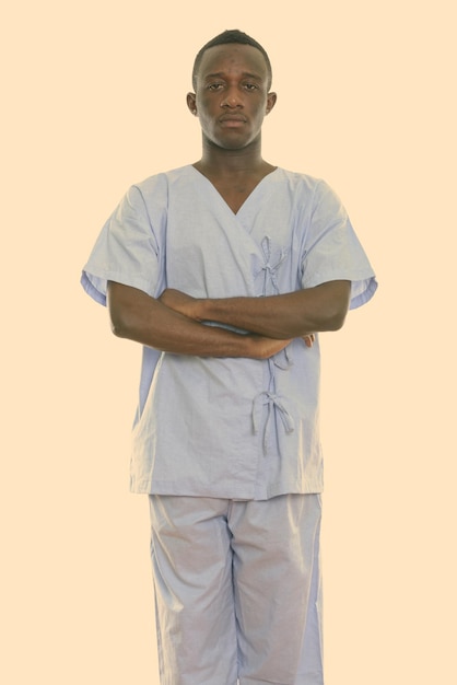 portrait of young man standing against white background