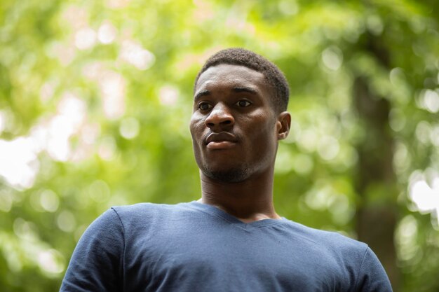 Portrait of young man standing outdoors