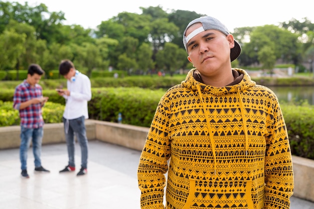 Portrait of a young man standing outdoors