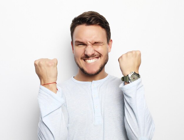 Portrait of a young man surprised face expression