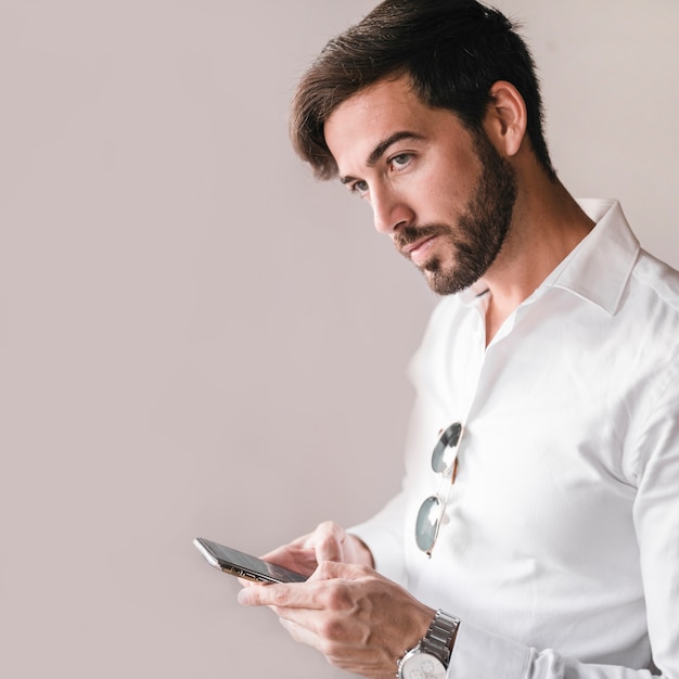 Portrait of a young man using smartphone