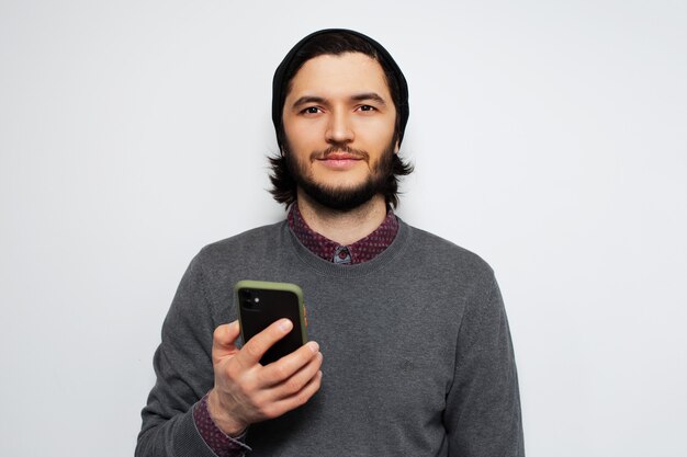 portrait of young man using smartphone.