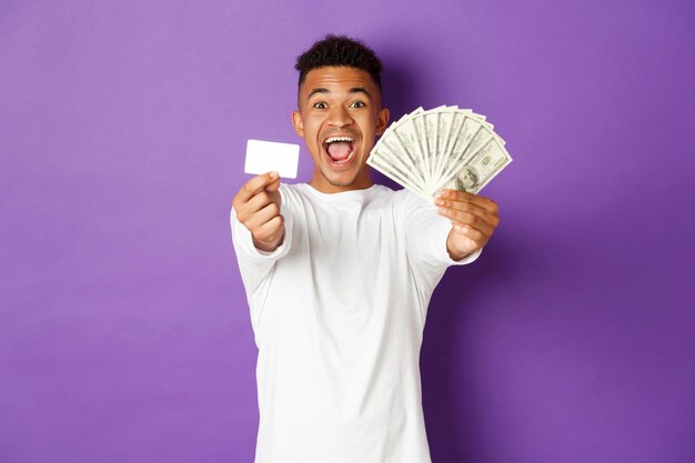 Portrait of a young man wearing mask against white background