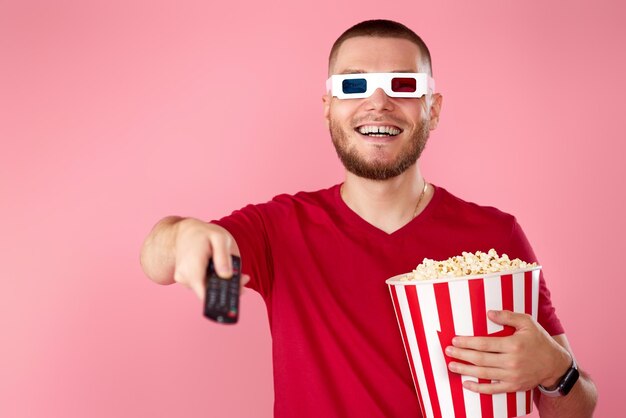 Portrait of young man wearing sunglasses against white background