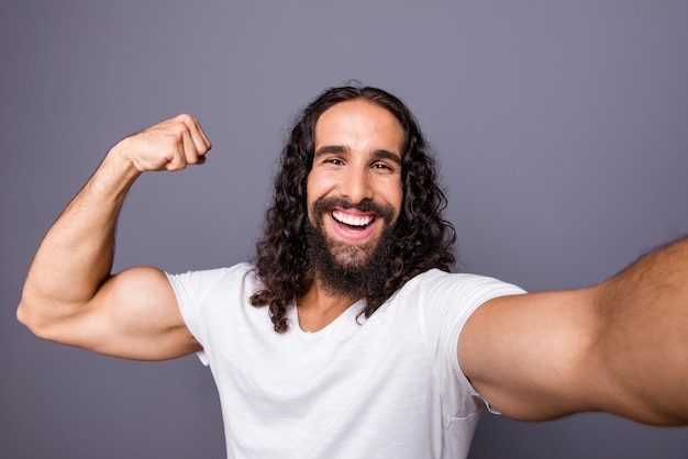 portrait young man with beard and long hair