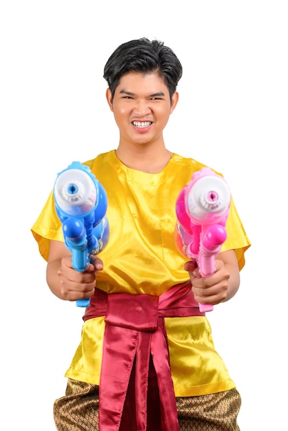 Portrait young man with water gun in Songkran Festival