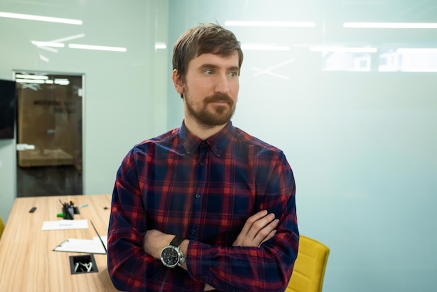 Portrait of a young man working in the office Business consultation online training coworking