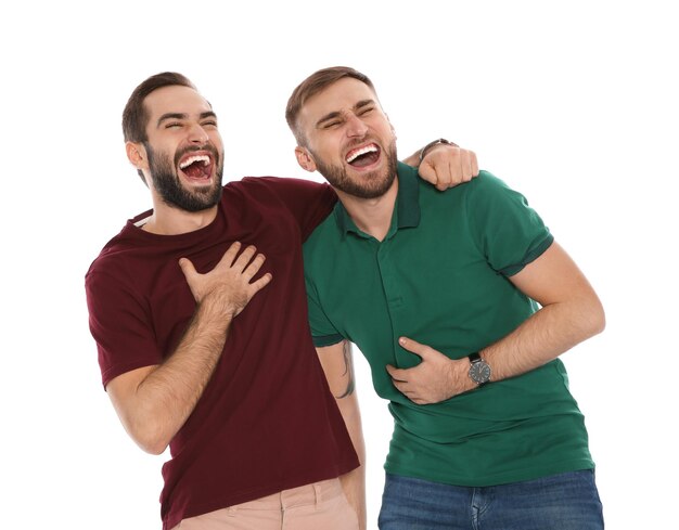 Photo portrait of young men laughing on white background