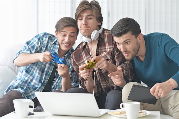 Portrait of a young men playing computer games