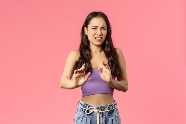 Portrait young mixed-race woman showing gesture.