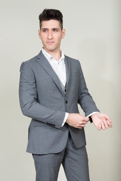 Portrait of young multi ethnic businessman in suit