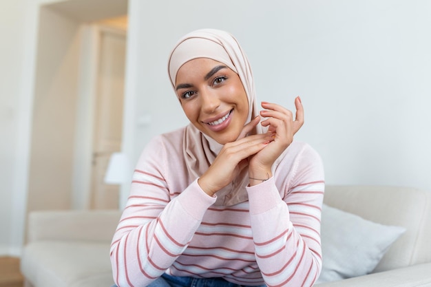 Portrait young muslim woman in headscarf smileHappy moment concept Headshot of a beautiful Muslim female model in a casual wear and hijab