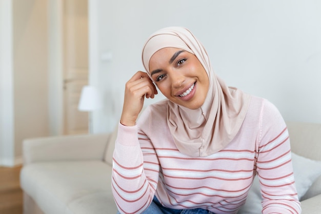 Portrait young muslim woman in headscarf smileHappy moment concept Headshot of a beautiful Muslim female model in a casual wear and hijab