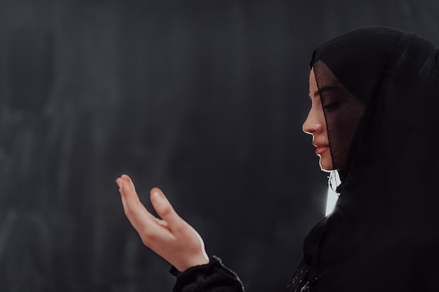 Portrait of young Muslim woman making dua. High quality photo