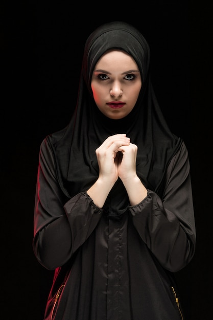 Portrait of young Muslim woman in traditional clothes