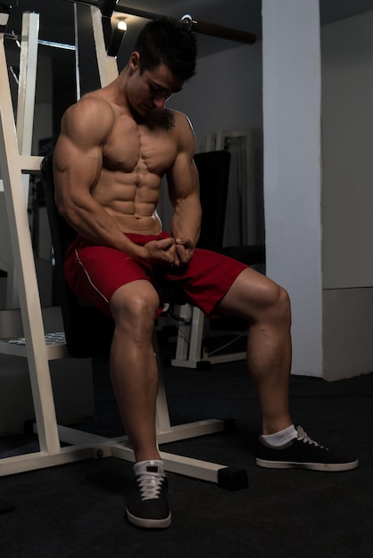 Portrait Of A Young Physically Fit Man Showing His Well Trained Body  Muscular Athletic Bodybuilder Fitness Model Posing After Exercises