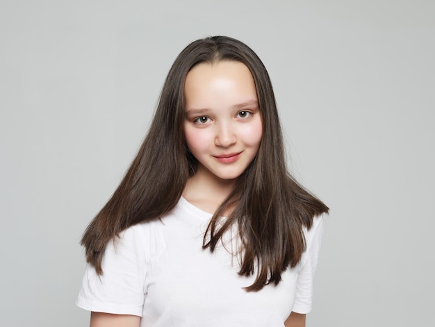 Portrait of young positive female with cheerful expression