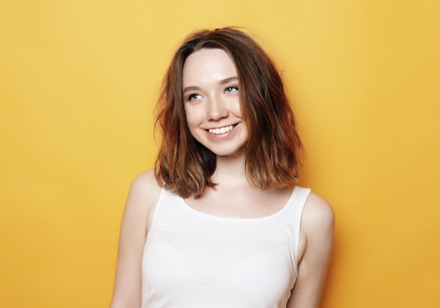 Portrait of young positive female with cheerful expression