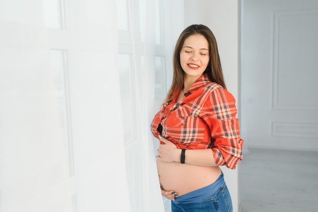 Portrait of the young pregnant woman